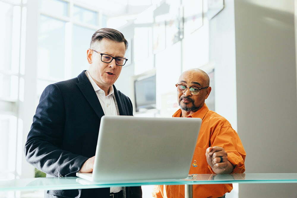 Men working on cash flow management together